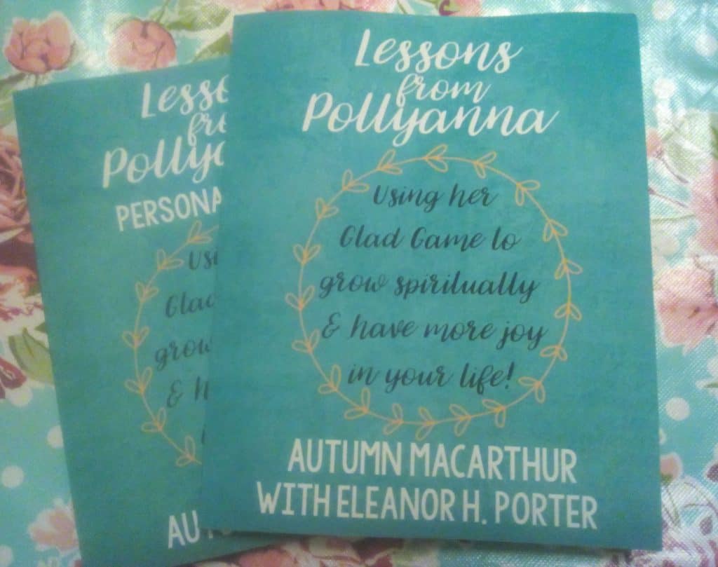 Ppaperback copies of lessons from Pollyanna devotional for women by Autumn Jane Macarthur and the accompanying journal
